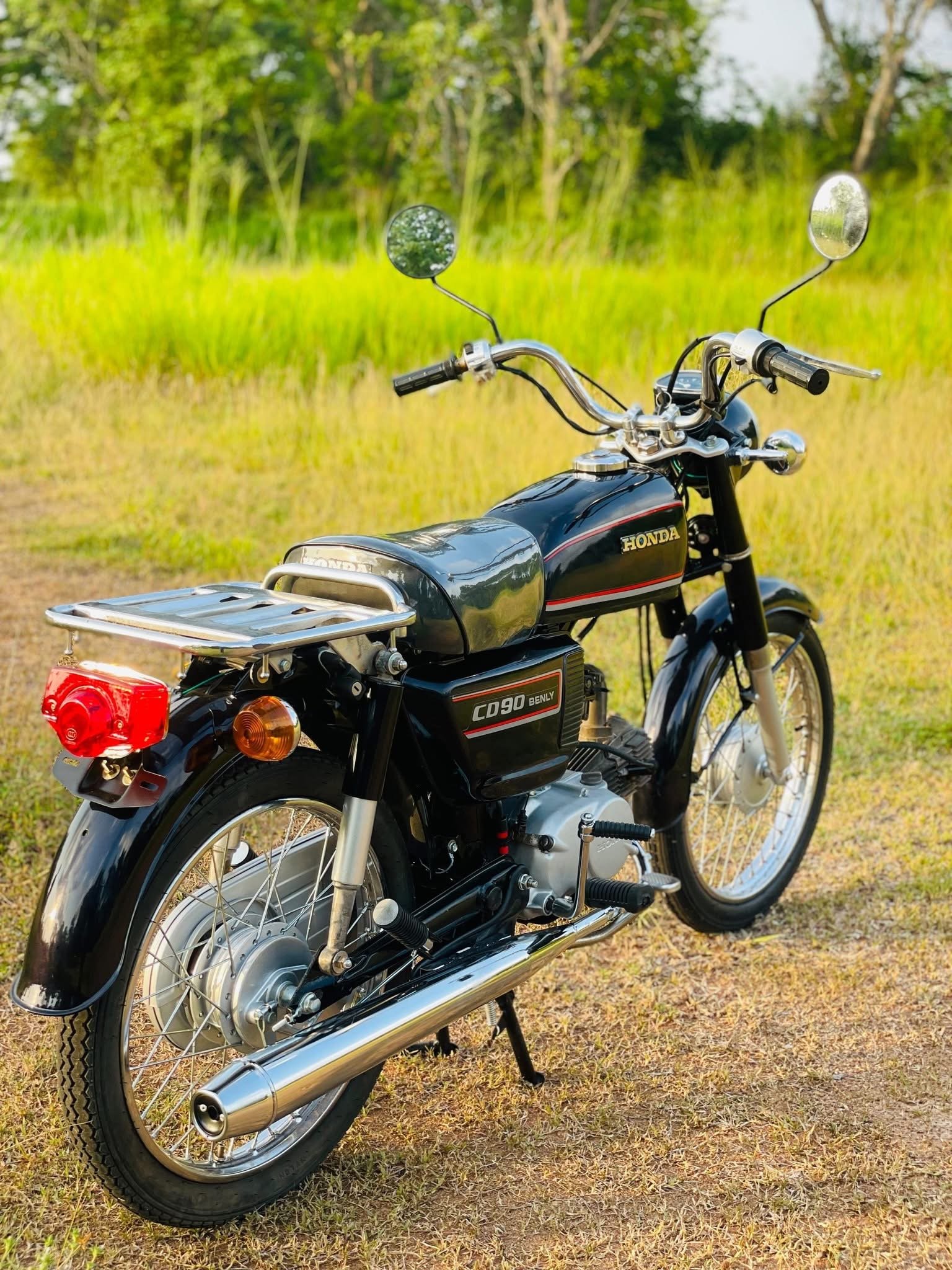 Rear three-quarter view of restored Honda CD90